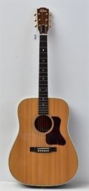 Gibson J-60 Acoustic Guitar
spruce top with rosewood back and sides,
rosewood fingerboard with pearl dot inlay
and gold tuners, 40 1/2" long
manufactured 1996
with soft case