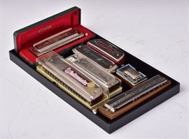 Group of Six Harmonicas
including Hohner Super Chromonica, 
The 64 Chromonica, Horner Chrometta 8,
The Vermona Weltmeister, Chromatica, 
and The Bandmaster De Luxe Chromatic
together with a Horner pitch pipe