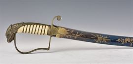 U.S. Eagle Pommel Officer's Saber
with cast brass eagle head pommel and
a bone grip, the 29 1/2" blade with
gold-washed engraving featuring
an American shield and cannons
original leather scabbard
early 19th century