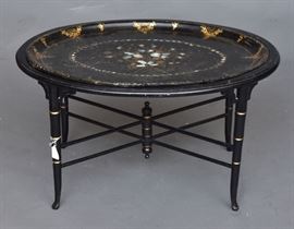 Lacquerware Tray Table
with mother of pearl inlaid paper mache tray
32" x 25 1/2", 17 3/4" high
early 20th century