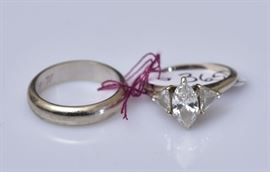 14k Gold Diamond Ring
set with approximately 1 ct marquise cut
diamond set with two triangular
side diamonds, ring size 5 together 
with a 14k gold wedding band, ring size 4 1/4
4 dwt gross