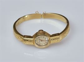 18k Gold Tissot Ladies Wrist Watch
with engraved bracelet
in the original box
6 1/4" wrist size, 8.6 dwt gross