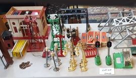 Group of Train Accessories
including Lionel city hall, street lights,
beacons, bridges, trees and 2 oil derricks
