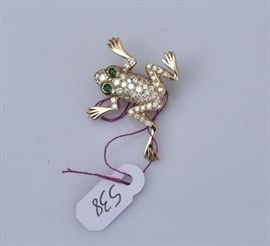 14k Gold Diamond Frog Brooch
50 brilliant cut diamonds, approx. .72 ct tw
and emerald eyes
1" long, 3.6 dwt gross