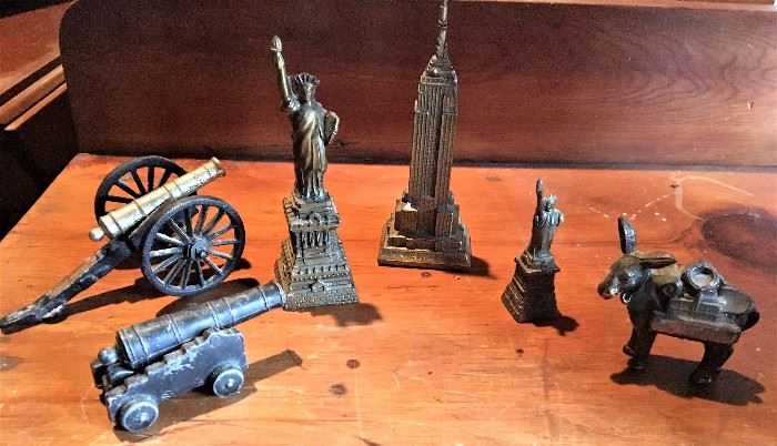 Miniature souvenir metal statues, landmarks and cannons