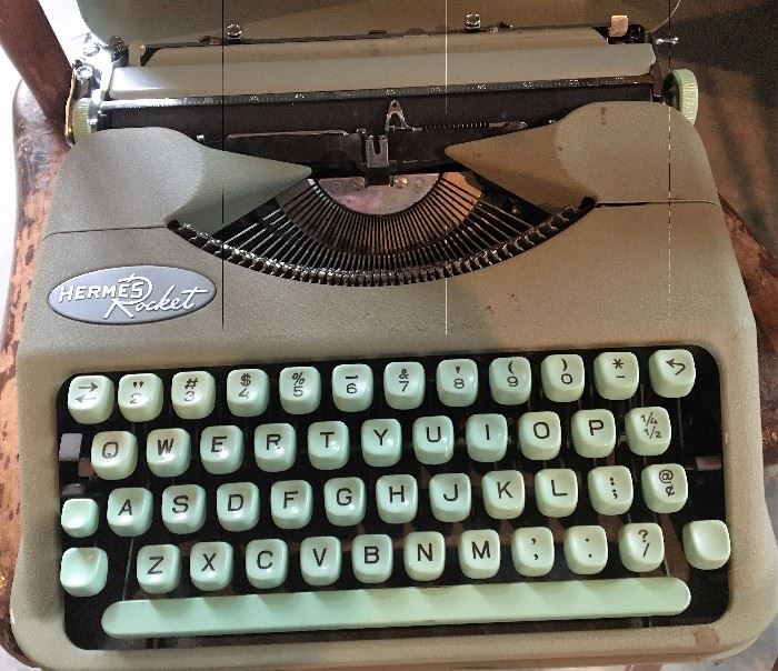 Vintage Hermes Rocket typewriter and case.