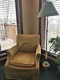 Vintage upholstered chair and floor lamp