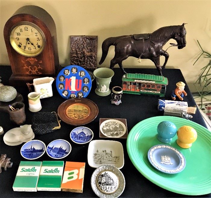 Leather horse, tin toy cable car, Smokey the Bear figurine, Royal Copenhagen miniature plates, vintage cigarette advertising playing cards, Wedgewood jasperware.