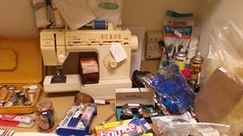 2 sewing machines, portable and one with table