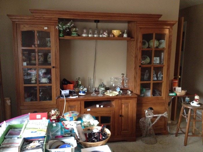 Entertainment center, collectibles and basket of watches