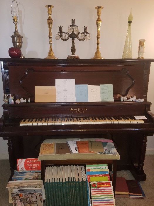 Upright piano early 1900s, candelabras, music books, & more.