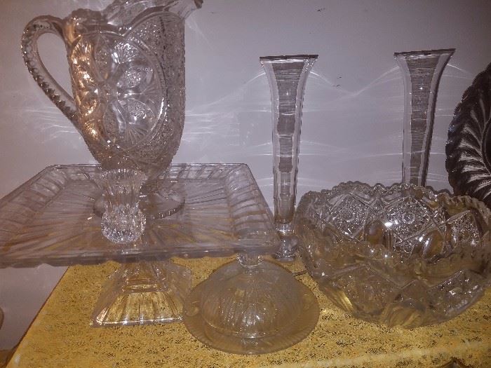 Cut glass bowls, pitcher, serving plate, vases, & more.