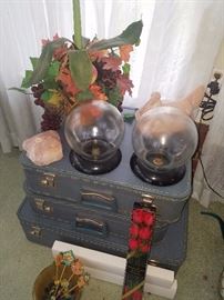 Vintage suitcases, globes/flower frogs, pink hen on nest, pink quartz, and more