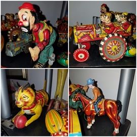 Wind up metal toys including MAR Crazy Car, MAR roller skating clown, cowboy on horse, & cat with ball
