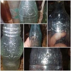 Antique bottles including White Line (Helena, GA), Nu-Grape, Soda Water, Buffalo Rock, R.C., and more. 