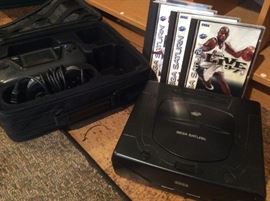 Sega Saturn gaming set with carrying case and games
