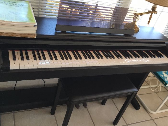 Like new Yamaha electric piano with bench and music 