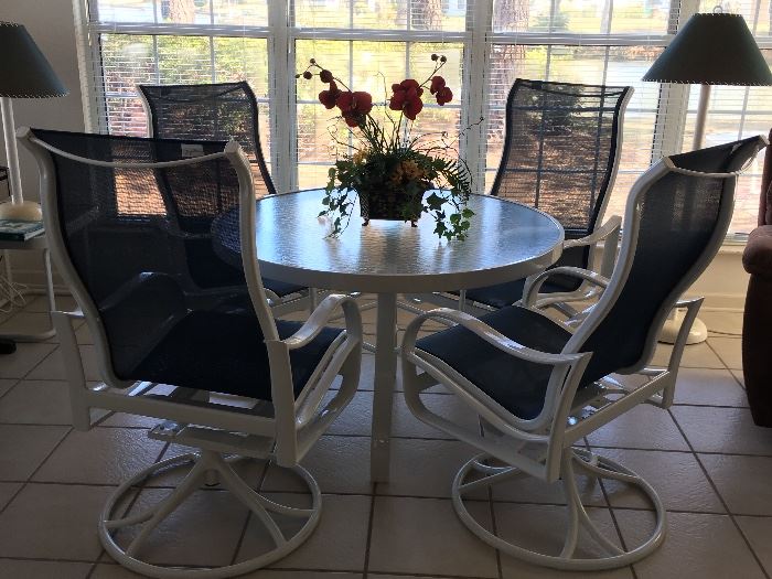 High end patio table with 4 chairs, used indoors only. $700 