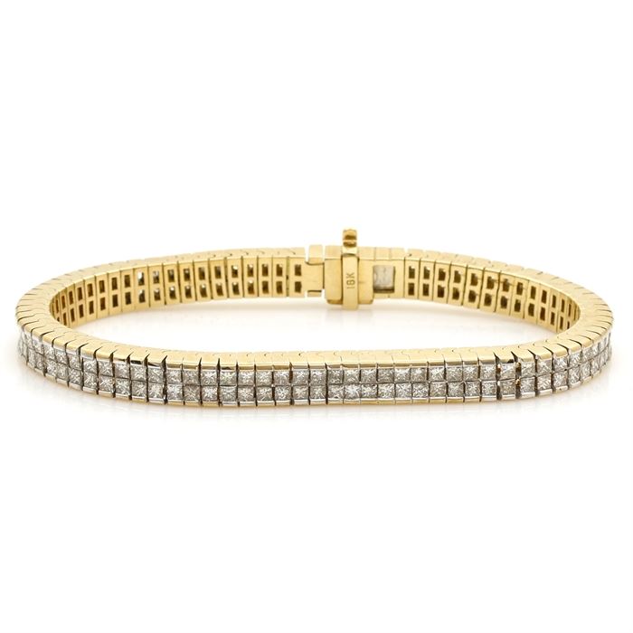 18K Yellow Gold Diamond Tennis Bracelet: An 18K yellow gold diamond tennis bracelet.