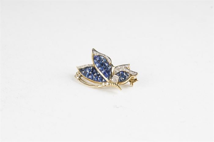 18K Gold Butterfly Pin with Diamonds and Sapphires: A 18K gold butterfly pin with diamonds and sapphires.