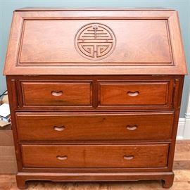 Chinese Oak Secretary Desk: A Chinese oak secretary desk. This piece has a secretary foldout desk along the top with a Chinese symbol embedded into the exterior. Along the inside are a small drawer and filing compartments. This desk also has two small and two large drawers along the front.
