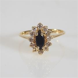 14K Yellow Gold Black Onyx and Diamond Ring: A 14K yellow gold black onyx and diamond ring.