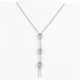 14K White Gold Diamond Lariat Necklace: A 14K white gold diamond lariat necklace.