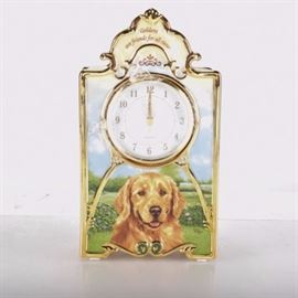 Bradford Exchange Porcelain Clock with Golden Retriever: A porcelain clock featuring a golden retriever from Bradford Exchange. The clock is battery operated and has a golden retriever painted on front and the line Goldens are friends for all time. The art is by Linda Pickens. A certificate of authenticity is included.