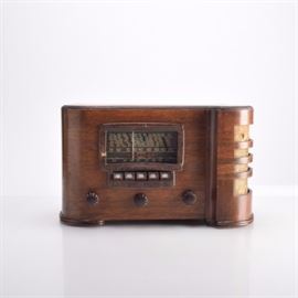 Crosley Vintage Tube Radio: A Crosley vintage tube radio. The radio is in a walnut case with speakers on the side. It has both push button and knob dials. The back is missing.