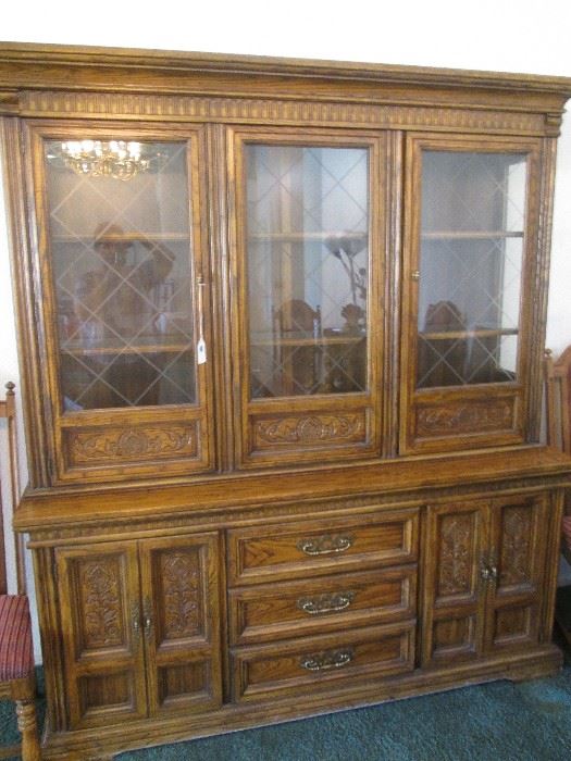 Matching China Cabinet with carved detailing and antique brass hardware. Loads of storage and display.