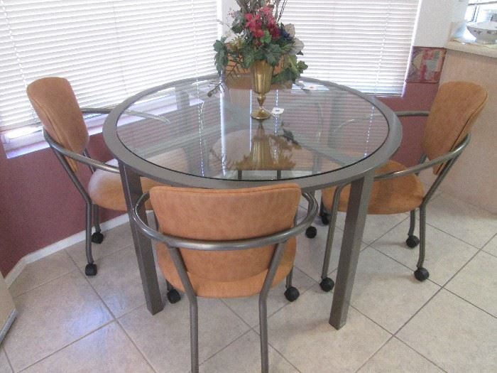Cute Dinette Set, glass top, metal framework and upholstered chairs