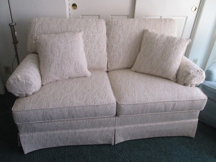 Flexsteel Love Seat, neutral colored upholstery.