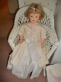 VINTAGE DOLL, WICKER CHAIR