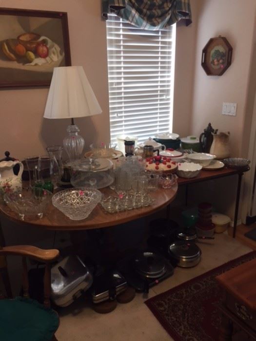 Various pots and pans, large crystal serving pieces, glassware, dishes