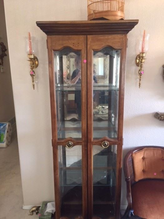 Tall narrow hutch with wood and glass, candle sconces, chair