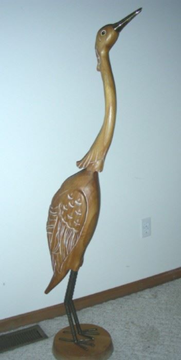 Carved wooden crane sculpture