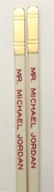 Mr. K's chopsticks made for & used by Michael Jordan; provenance: Mr. K's restaurant; the restaurant custom made chopsticks for celebrities/political figures to use when they dined there; Mr. K's would engrave that person's name on those chopsticks and that person would use those chopsticks when dining at the restaurant; each of these chopsticks is offered with a certificate of authentication (written by Mr. K's managing partner, John Fong); 10.46in(L)