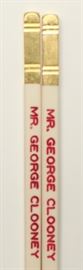 Mr. K's chopsticks made for & used by George Clooney; provenance: Mr. K's restaurant; the restaurant custom made chopsticks for celebrities/political figures to use when they dined there; Mr. K's would engrave that person's name on those chopsticks and that person would use those chopsticks when dining at the restaurant; each of these chopsticks is offered with a certificate of authentication (written by Mr. K's managing partner, John Fong); 10.46in(L)
