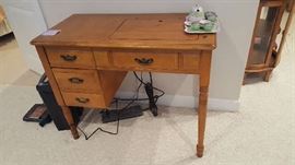 Singer Sewing machine and cabinet   $50  Buy ahead