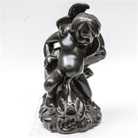 2010 Black Rookwood Pottery Sculpture: A 2010 black Rookwood Pottery sculpture. Depicted is a young boy and a fish. Marked to base the Rookwood Pottery hallmark, “MMX”, and “GDS”.