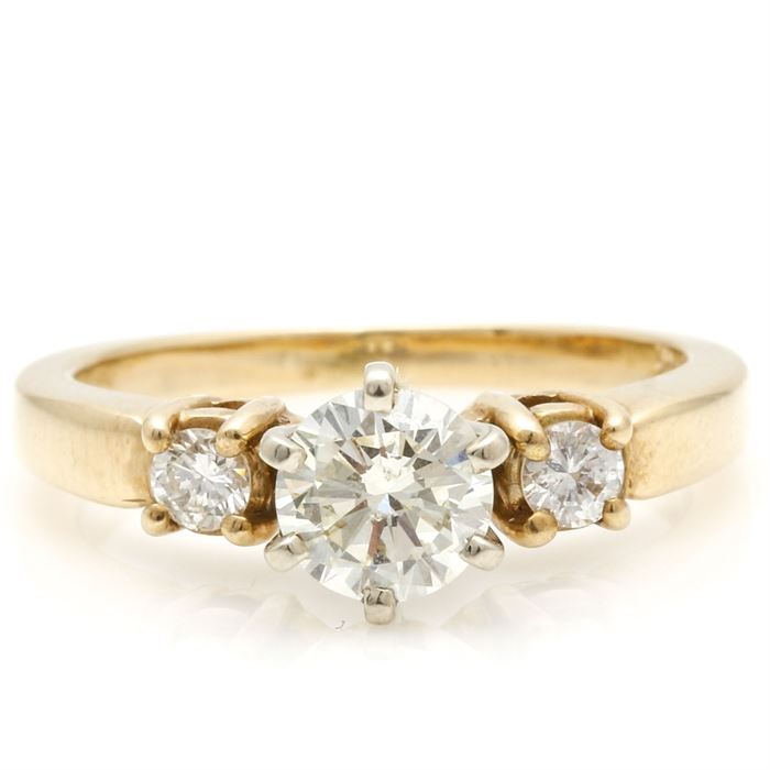 14K Yellow Gold Diamond Ring: A 14K yellow gold diamond ring. The total approximate group diamond weight is 0.69 ctw.