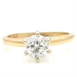 14K Yellow Gold Diamond Solitaire Ring: A 14K yellow gold diamond solitaire ring.