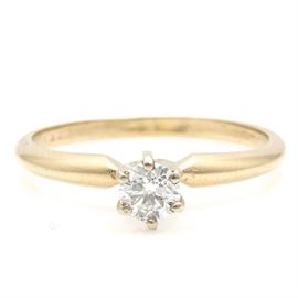 14K Yellow Gold Diamond Solitaire Ring: A 14K yellow gold diamond solitaire ring.
