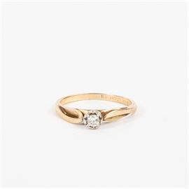 14K Yellow and White Gold Diamond Solitaire: A 14K yellow and white gold diamond solitaire.
