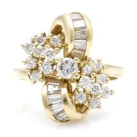18K Yellow Gold Diamond Cluster Ring: An 18K yellow gold diamond ring. This ring features a clustered arrangement housing multiple cuts of diamonds. The total approximate diamond carat weight is 0.96 ctw.