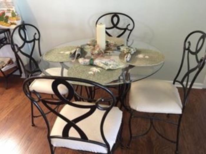 Wrought Iron Table with Glass Top and Four Wrougnt Iron Chairs