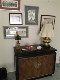 Really lovely framed prints, two door chest with Asian door pulls. Brass accents on top.