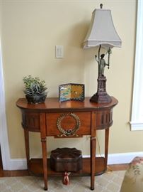 Console table with laurel wreath decor