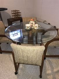ROUND GLASS-TOP TABLE WITH 4 CHAIRS - 48” IN DIAMETER AND 28.5”TALL