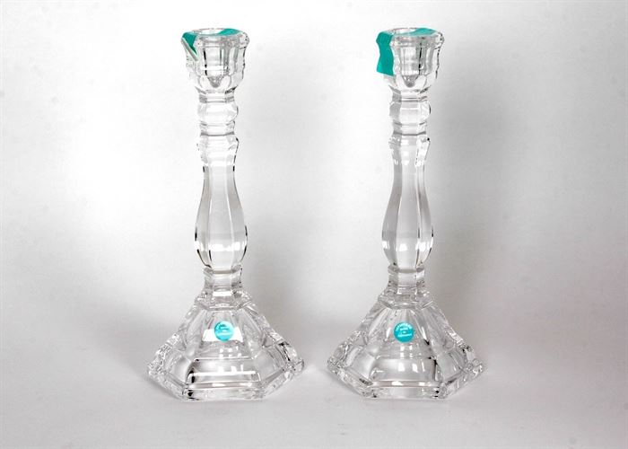 Pair of Tiffany & Co. Crystal Candle Holders: A pair of Tiffany & Co. crystal candle holders. This pair of candle holders are made of crystal. They are new and unused and come in the original box. Each is marked on the base. They are made in Germany.